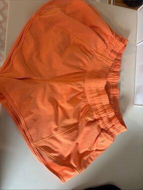 Women’s Lululemon 2.5 low rise hotty hot shorts in orange soda